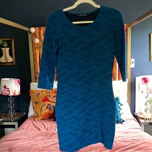 Blue form fitting sweater dress